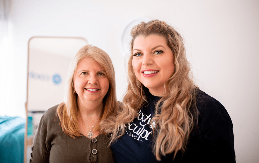 Katrina and a Body Sculpt Client smiling together